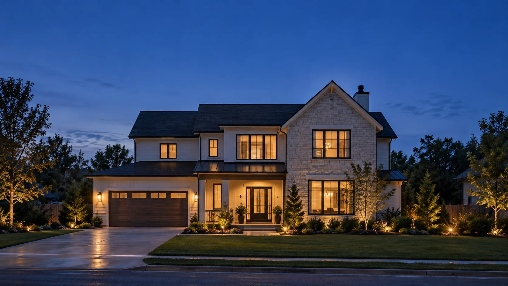 Illustrative modern home at dusk with warmly lit rooms
